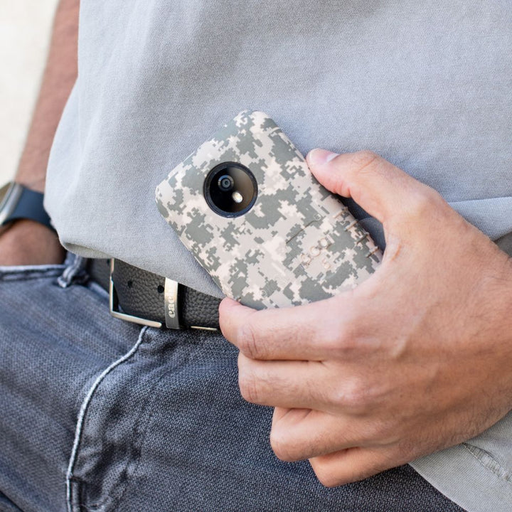 Man holding an Omnipod 5 with a Digital Camo Omnipod® 5 Case with Camera Cutout on it.