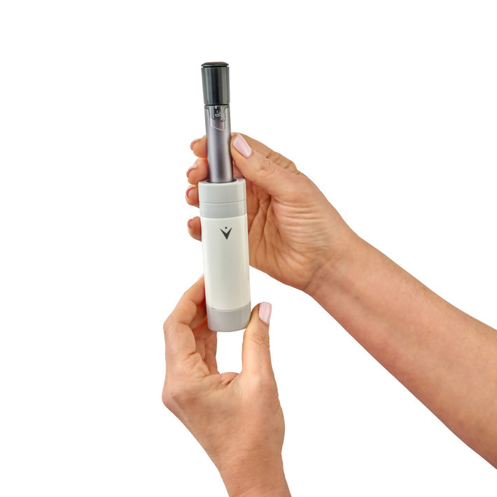 VIVI cap with top removed in hands showing an insulin pen.