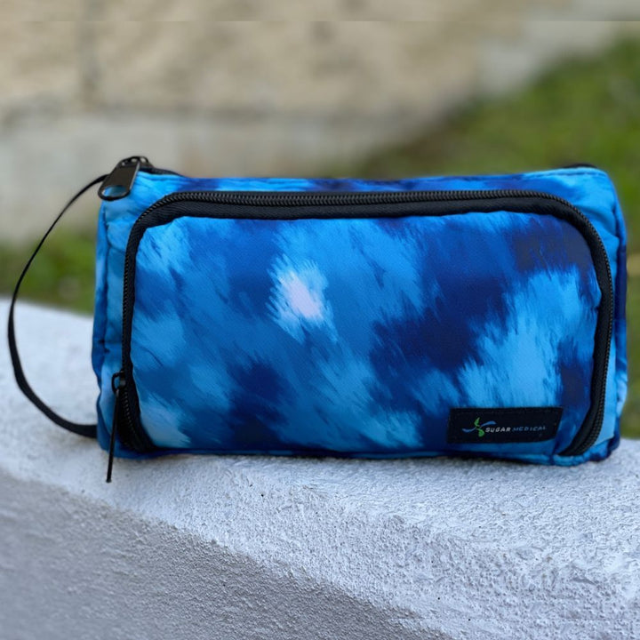 A blue wave pattern Insulated Diabetes Insulin Supply Case with black handle on the side.