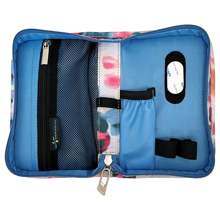 Sugar Medical Diabetes Supply Case II cream with blue, purple, and pink dots inside with pockets and loops to organize your diabetic supplies.