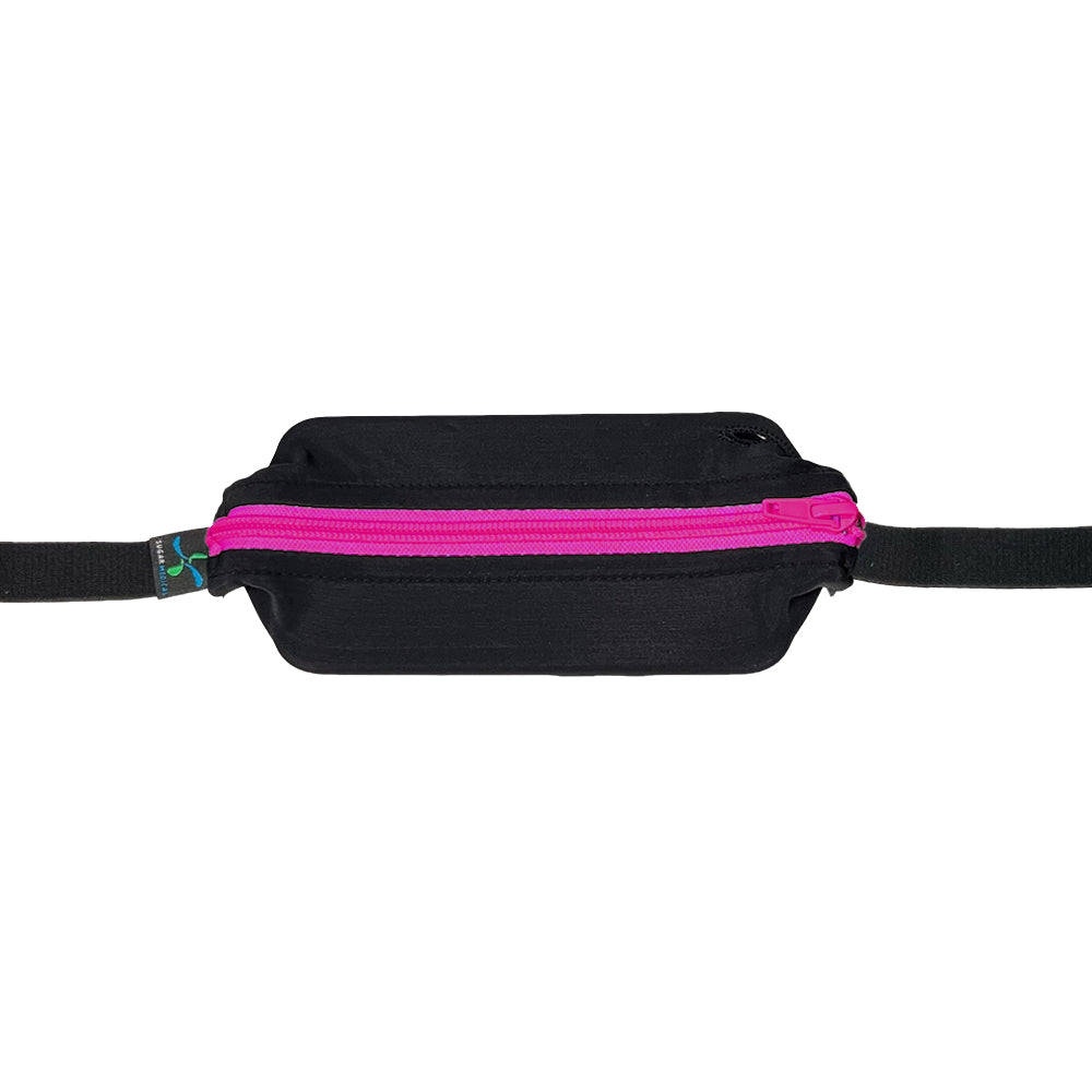 Black with pink zipper zipped closed with insulin pump inside.