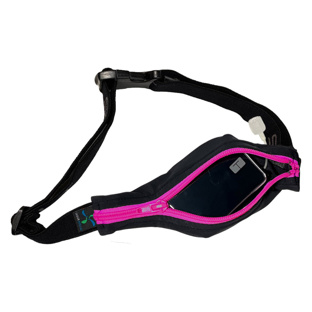 Black stretchy waist belt with pink zipper unzipped with insulin pump shown along with tubing coming out of the slit on the back side for easy access.