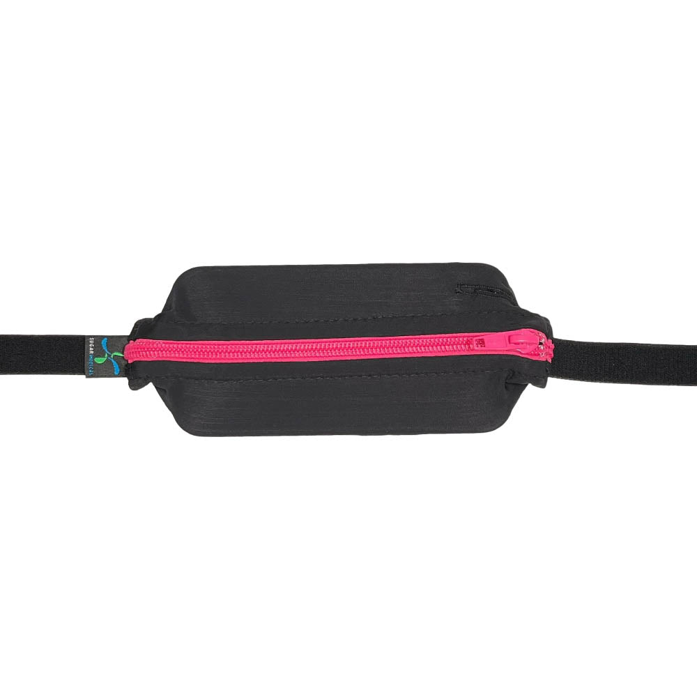 Kids black with pink zipper SPI belt closed with Omnipod 5 controller inside.