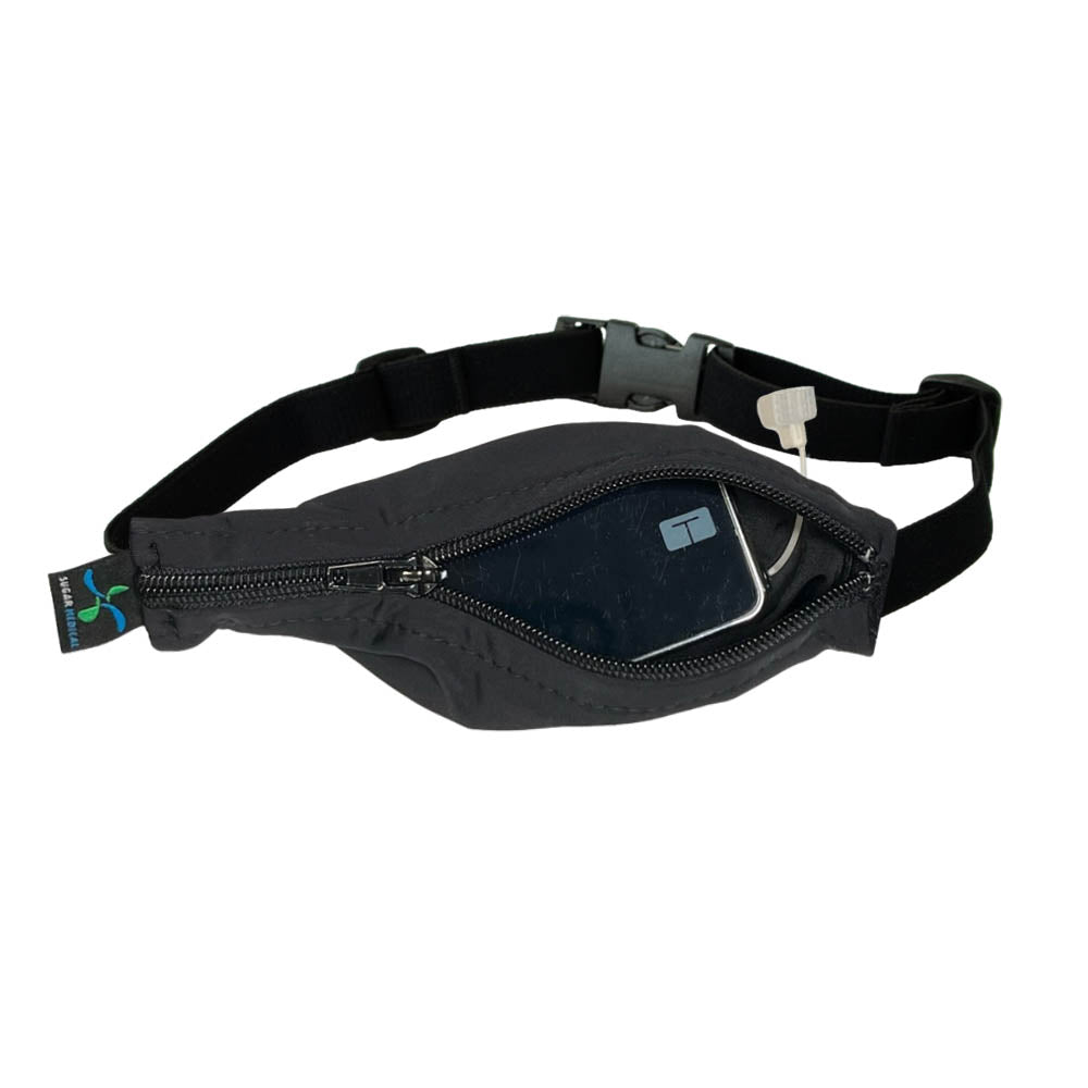 Kids black with black zipper SPI belt open with Tandem pump inside and tubbing coming out the side hole.