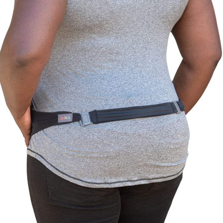 Women in grey t-shirt wearing the black belt extender for Bandi belt.