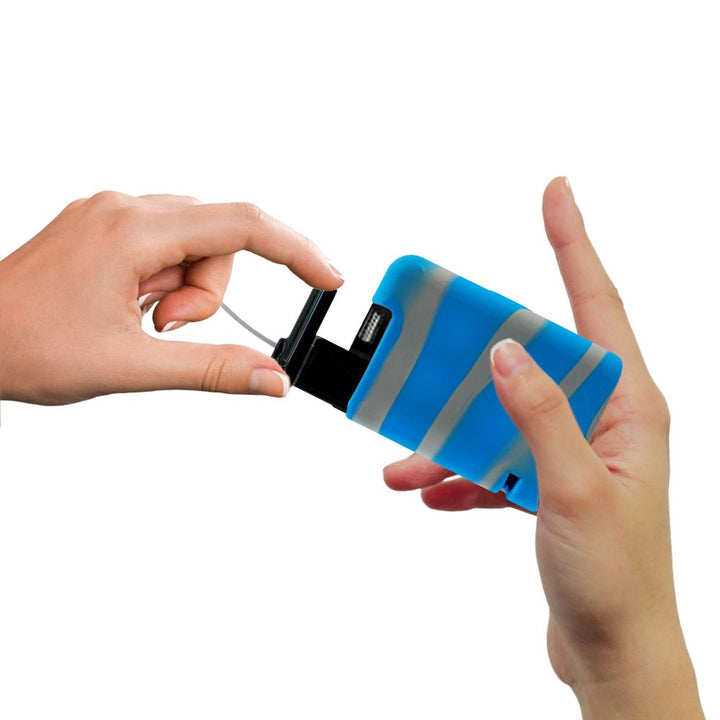 Hands pulling out a Tandem cartridge with a blue and grey tandem gel skin on the insulin pump.