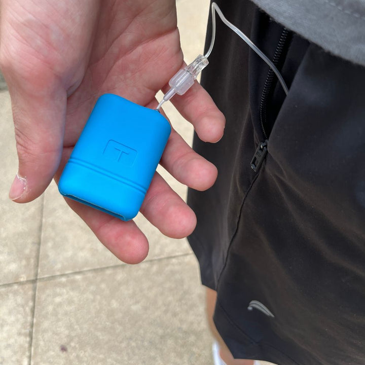 Blue Mobi Tandem gel skin in a man’s hand.