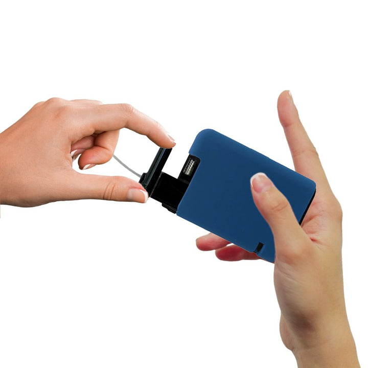 Hands pulling out a Tandem cartridge with a blue tandem gel skin on the insulin pump.
