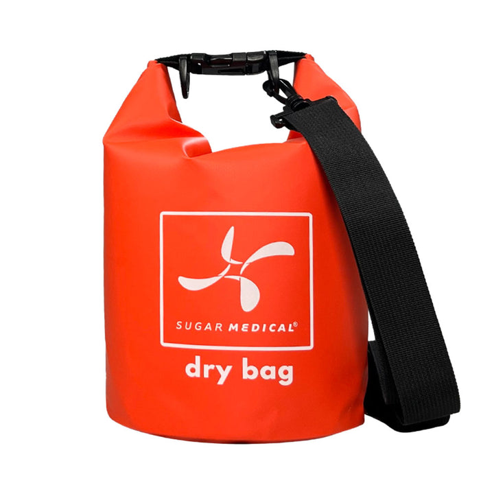 Front of a red Dry Bag with reinforced handles for durability and a shoulder strap easy transport.