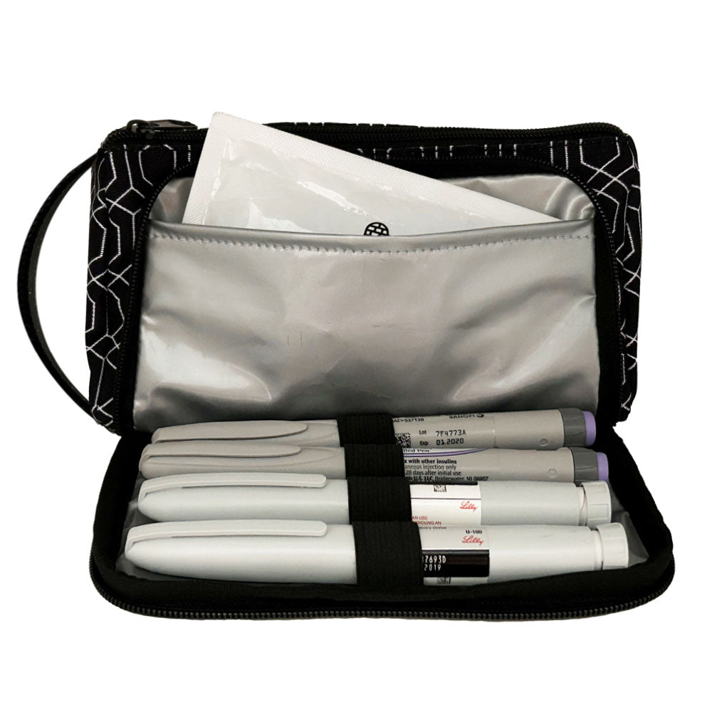 A black and white geometric pattern Insulated Diabetes Insulin Supply Case with insulated pocket open and an ice pack in slip pocket and four insulin pens secured in loops.