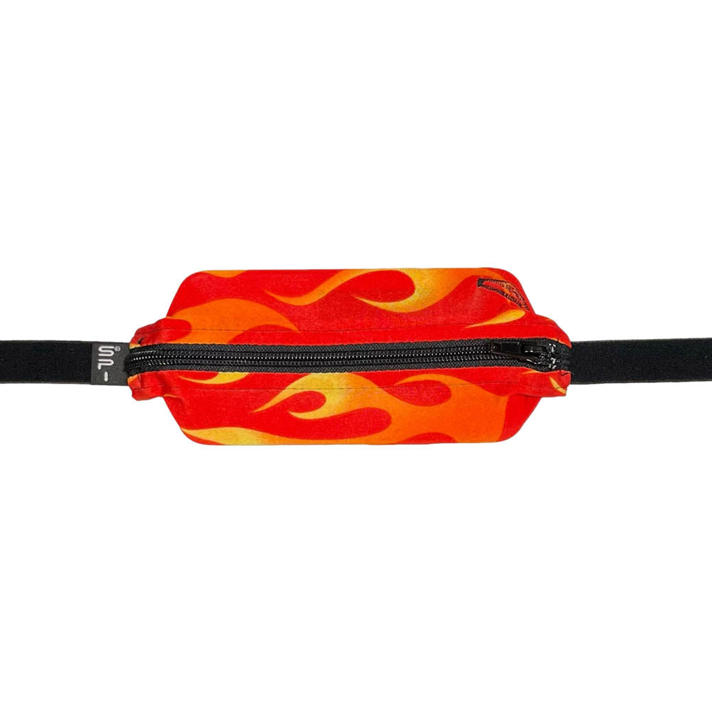 Kids red and orange flames SPI belt closed with Omnipod 5 controller inside.