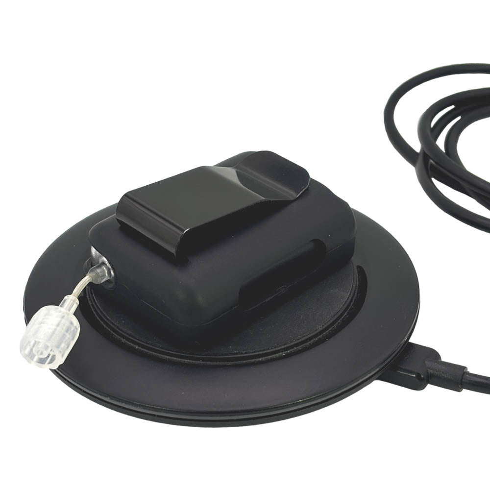 Black Tandem Mobi EZ-To-Charge Clip with Mobi insulin pump inside the case, laying flat on the charger.