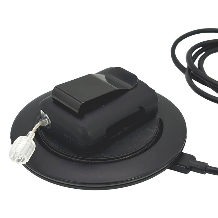 Black Tandem Mobi EZ-To-Charge Clip with Mobi insulin pump inside the case, laying flat on the charger.