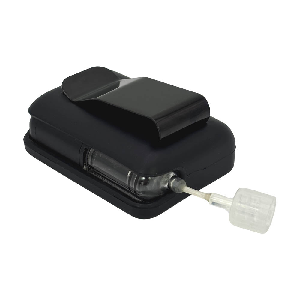 Black Tandem Mobi EZ-To-Charge Clip with Mobi insulin pump inside the case, laying flat on a surface.