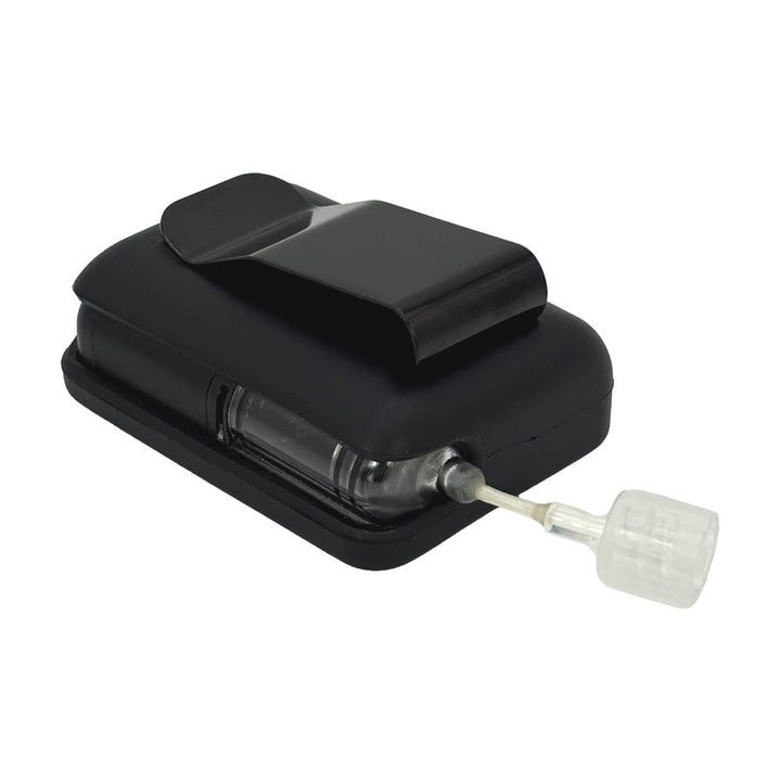 Black Tandem Mobi EZ-To-Charge Clip with Mobi insulin pump inside the case, laying flat on a surface.
