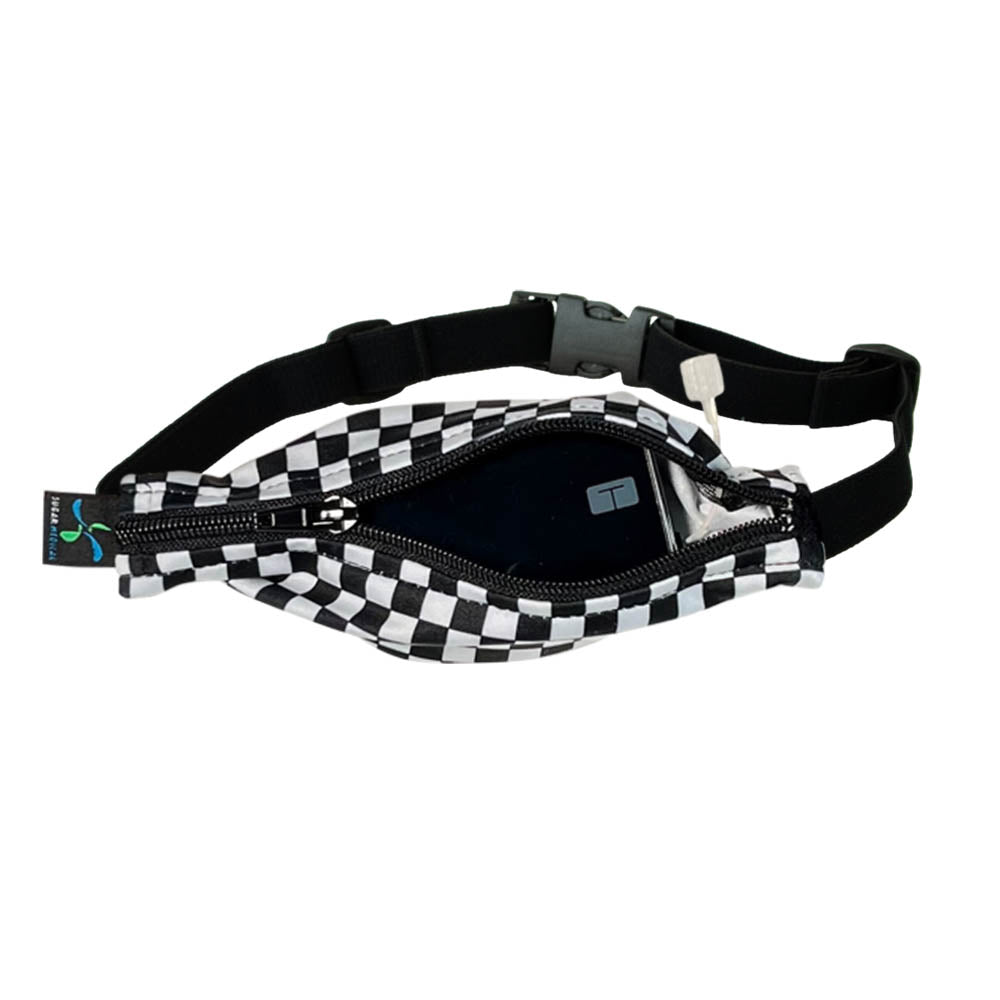 Kids black and white checkered patter with black zipper SPI belt open with Tandem pump inside and tubbing coming out the side hole.