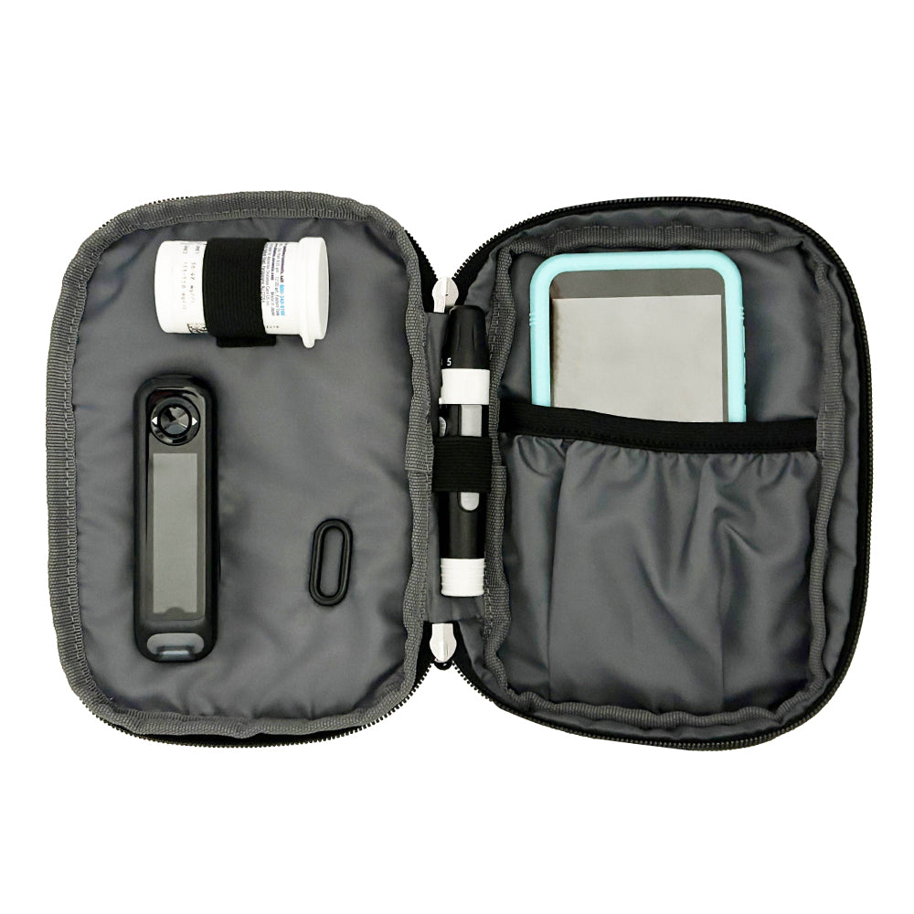 Diabetes Insulated Convertible Bag in light grey leopard print inside set up with glucose meter, test strips, lancet and Omnipod PDM.