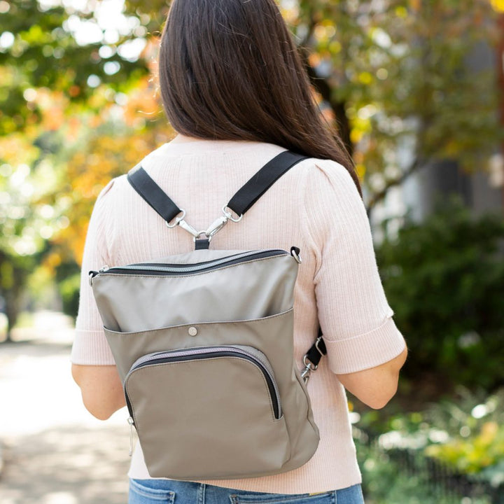 Women wearing Diabetes Nylon Backpack in tan on women’s back with two straps. 