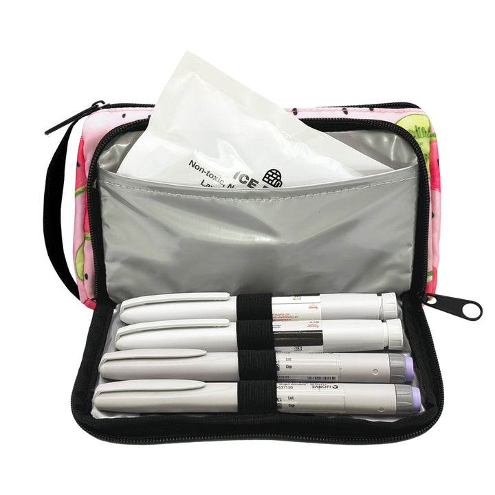 A pink watermelon pattern Insulated Diabetes Insulin Supply Case with insulated pocket open and an ice pack in slip pocket and four insulin pens secured in loops.