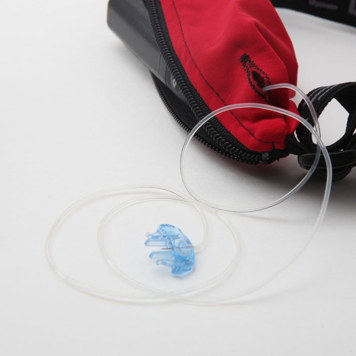 Kids black with blue zipper SPI belt open with Medtronic pump inside and tubbing coming out the side hole.