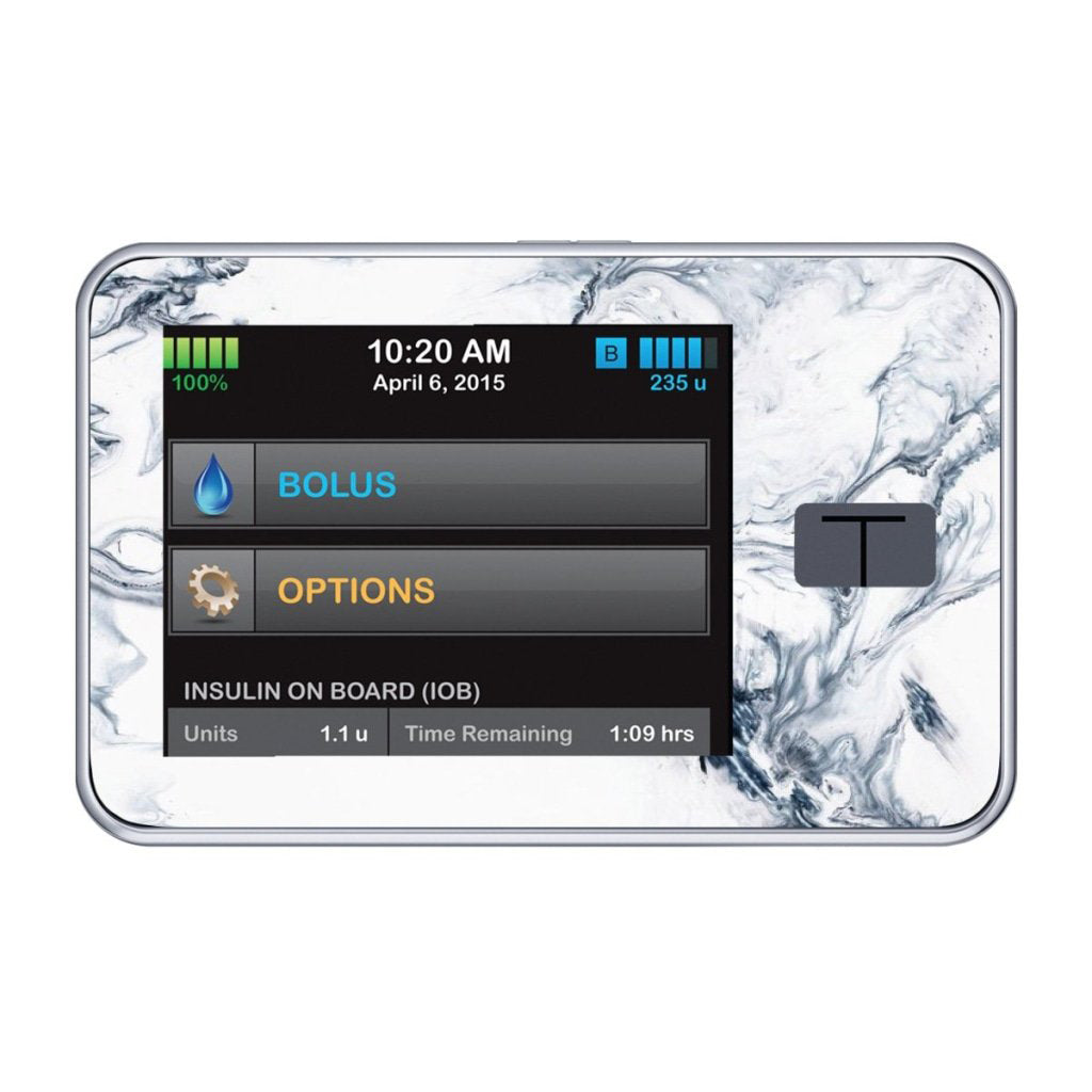 A fun sticker in a black and white marble pattern on the Tandem t-slim insulin pump