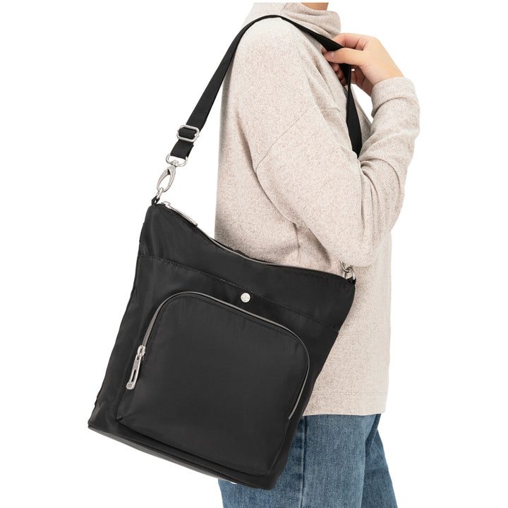 Women wearing Diabetes Nylon Backpack in black on shoulder with strap.