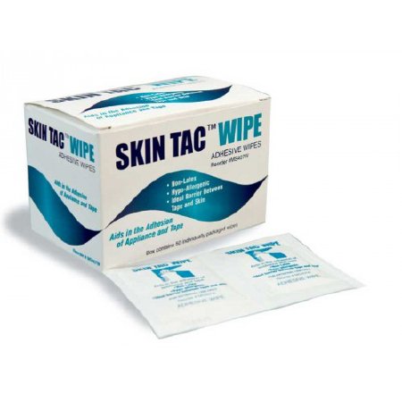 A box of 50 Skin Tac adhesive barrier wipes and two of the individual packets in front of the box
