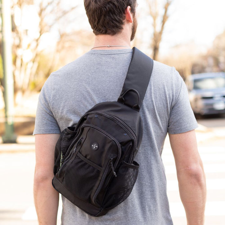 Diabetes Insulated Sling Backpack in black on back of male model.