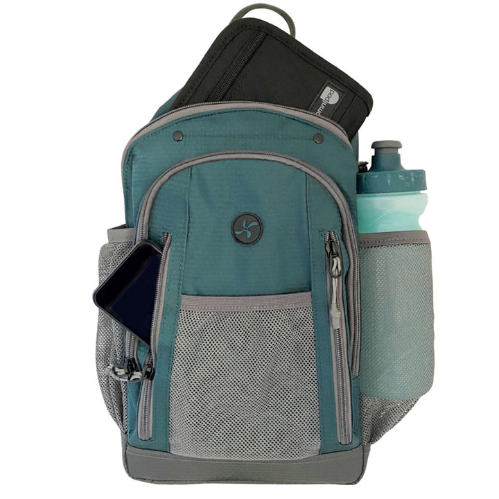 Diabetes Insulated Sling Backpack in green front zippered pocket with Omnipod 5 PDM, insulated back with diabetic supply case and water bottle inside mesh pocket. 