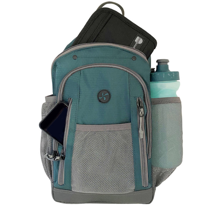 Diabetes Insulated Sling Backpack in green front zippered pocket with Omnipod 5 PDM, insulated back with diabetic supply case and water bottle inside mesh pocket.