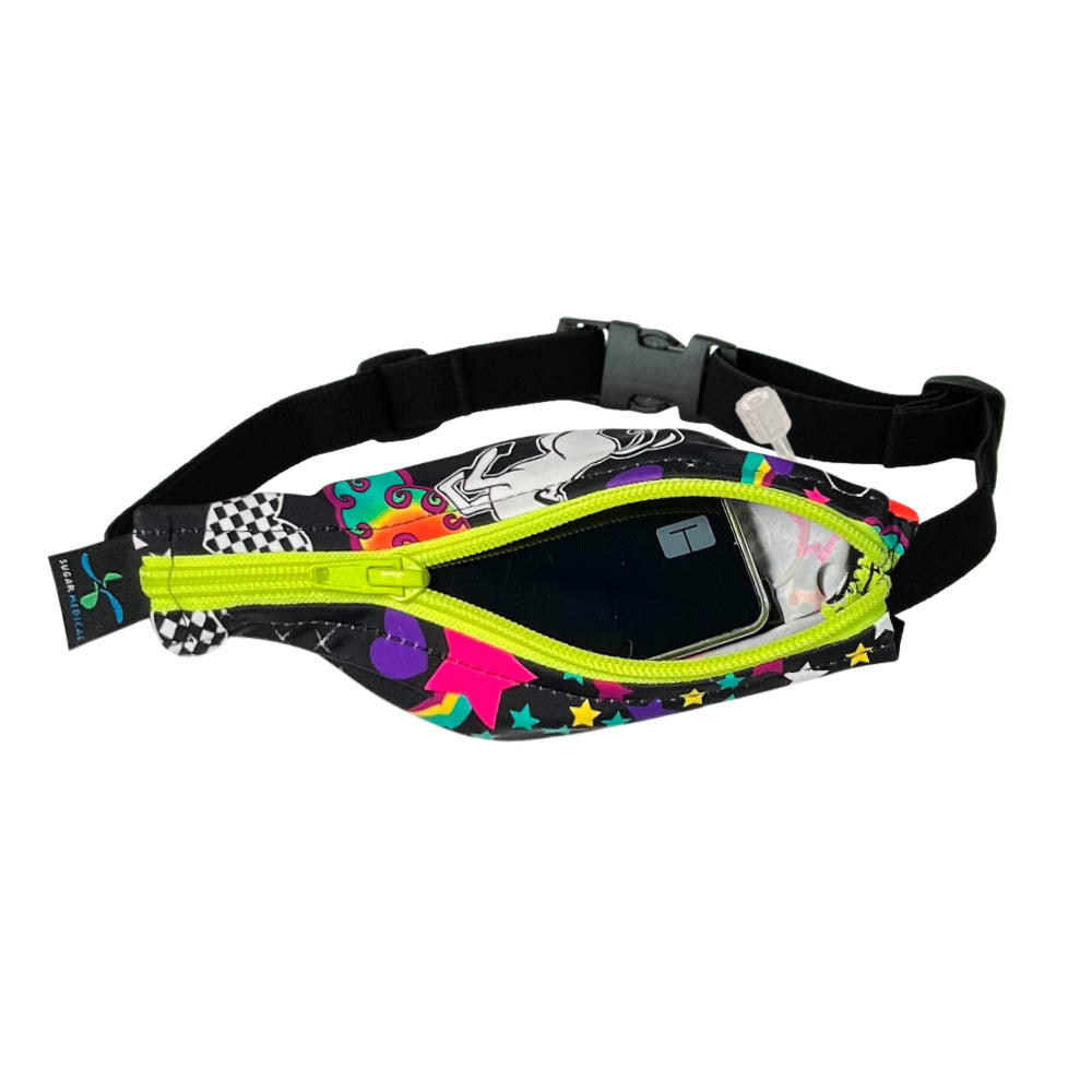 Kids unicorn patter with yellow zipper SPI belt open with Tandem pump inside and tubbing coming out the side hole.