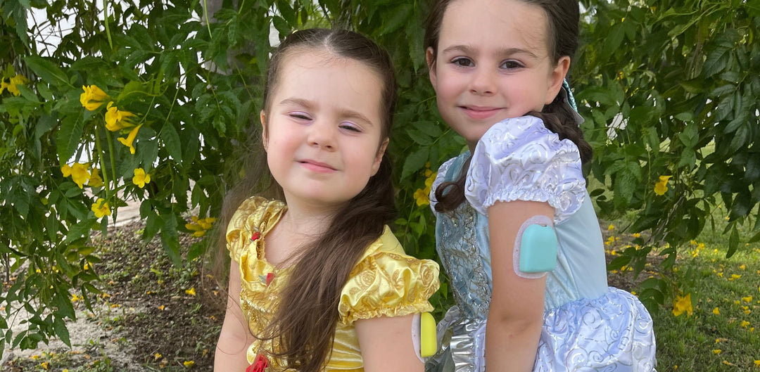 Two girls with Halloween customs on. 