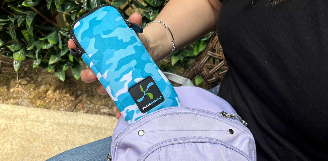 Women hand pulling out a neoprene case from a purple back pack. 