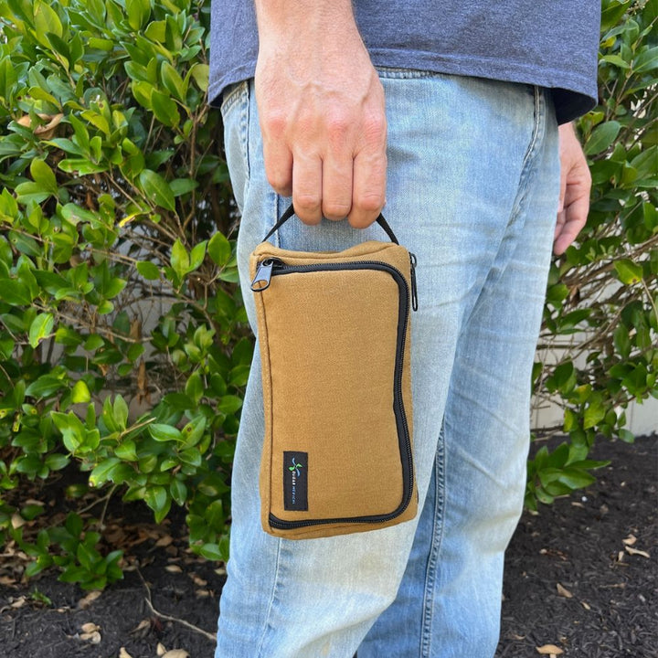 A man holding Insulated Diabetes Insulin Supply Case in Hamilton Brown with handle. 
