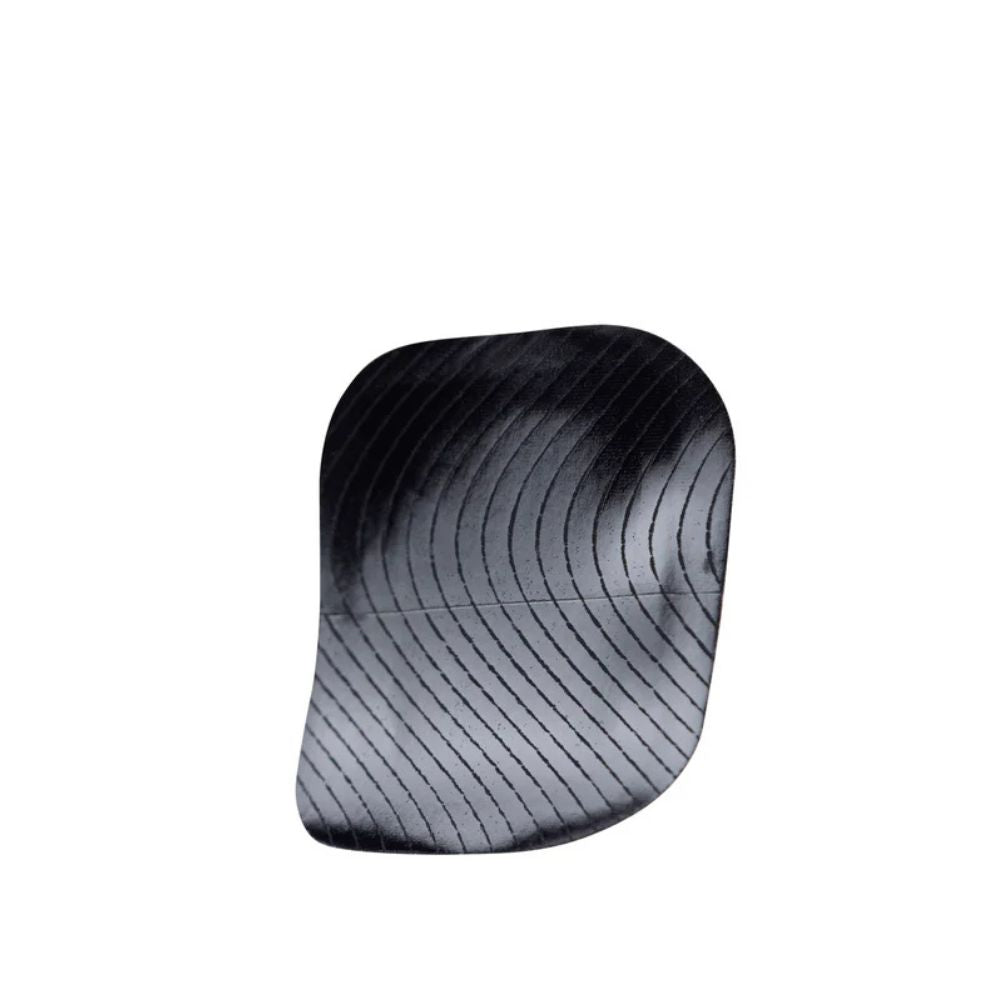 Black Skin Grip adhesive patch for Tandem Mobi insulin pump shown against a plain background.