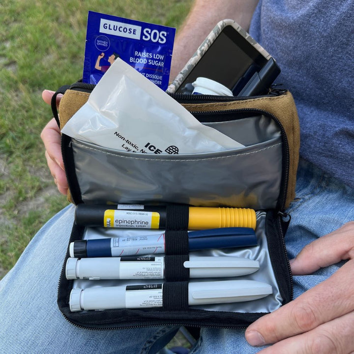 Open Hamilton Brown Insulated Diabetes Insulin Supply Case with four insulin pens, ice pack and Omnipod supplies in back zippered pocket. 