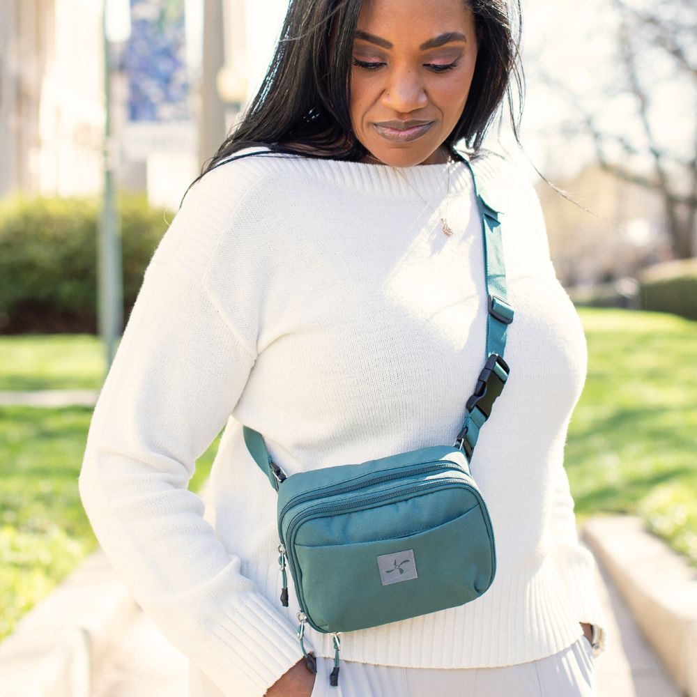 Women wearing the Green Pine Diabetes Insulated Convertible Supply Bag crossbody.