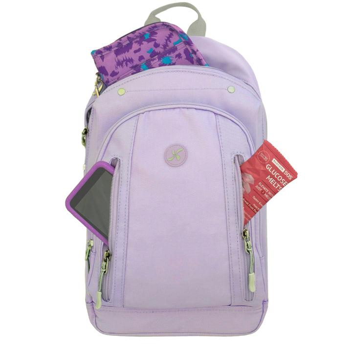 Diabetes Roam Insulated Sling Backpack in purple front pocket with glucose melts and Omnipod 5 PDM and Sugar Medical diabetes supply case in back pocket. 