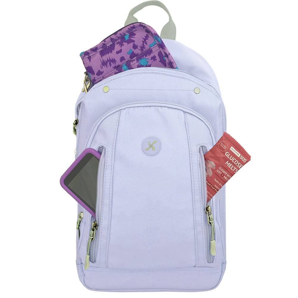 Diabetes Roam Insulated Sling Backpack in purple front pocket with glucose melts and Omnipod 5 PDM and Sugar Medical diabetes supply case in back pocket. 