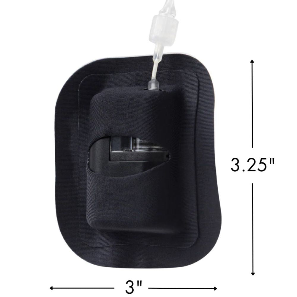 Black Skin Grip adhesive patch securely holding a Tandem Mobi insulin pump on skin; patch measures approximately 3.25 x 3 inches, designed for a snug, low-profile fit.