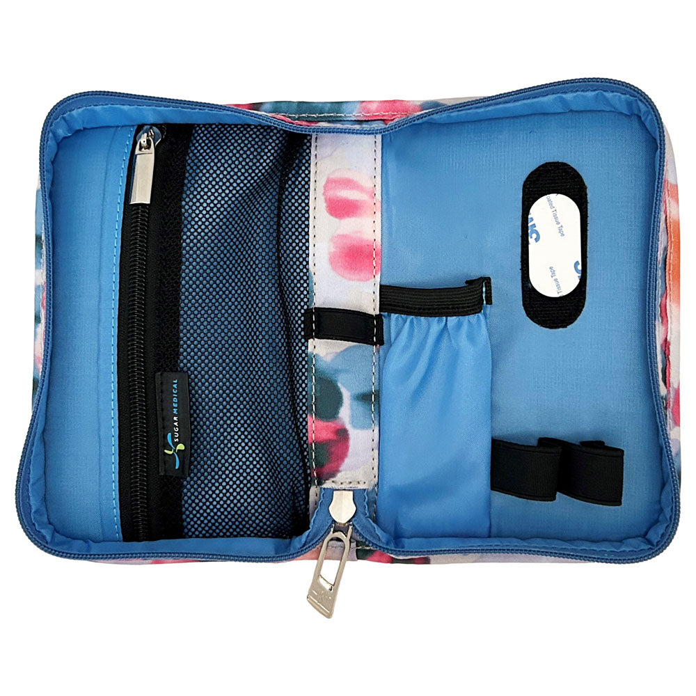 Sugar Medical Diabetes Supply Case II cream with blue, purple, and pink dots inside with pockets and loops to organize your diabetic supplies. 