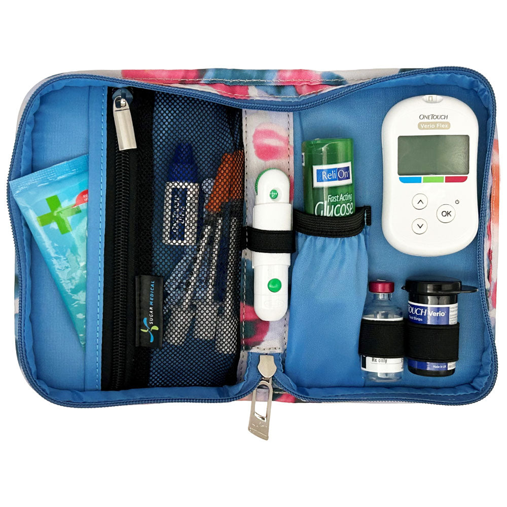 Sugar Medical Diabetes Supply Case II cream with blue, purple, and pink dots inside set up with glucose meter, test strips, lancet, glucose tabs and wipes. 