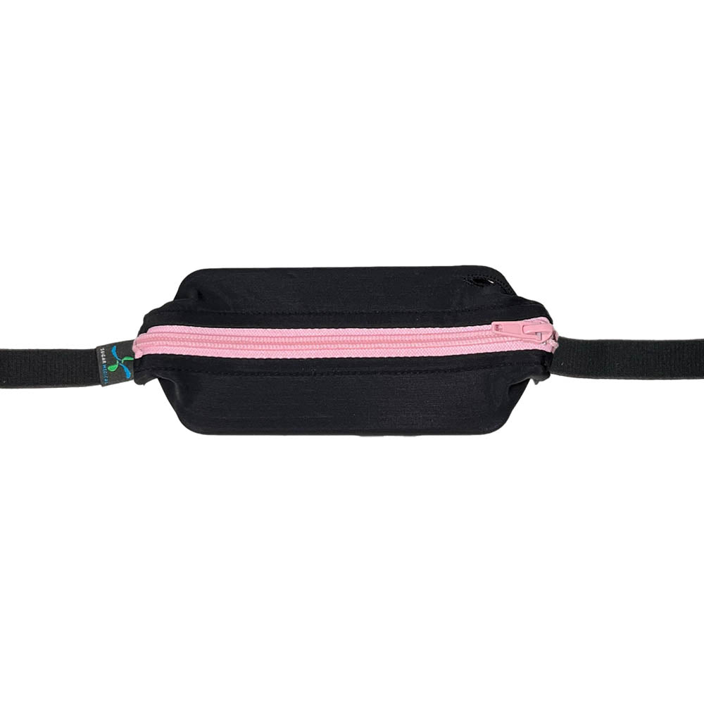 Black with light pink zipper zipped closed with insulin pump inside.