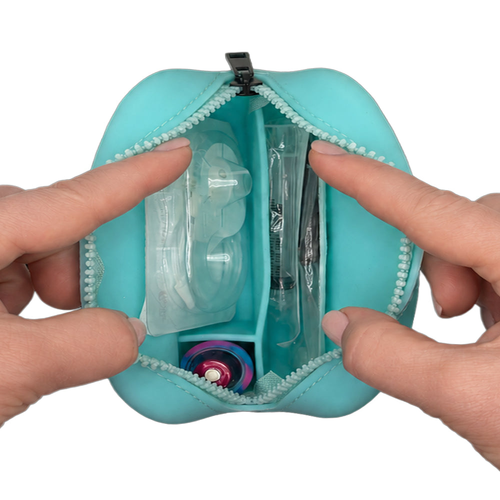 Aqua Tandem Protective Travel Case with Tandem supplies, held open by hands on a white background