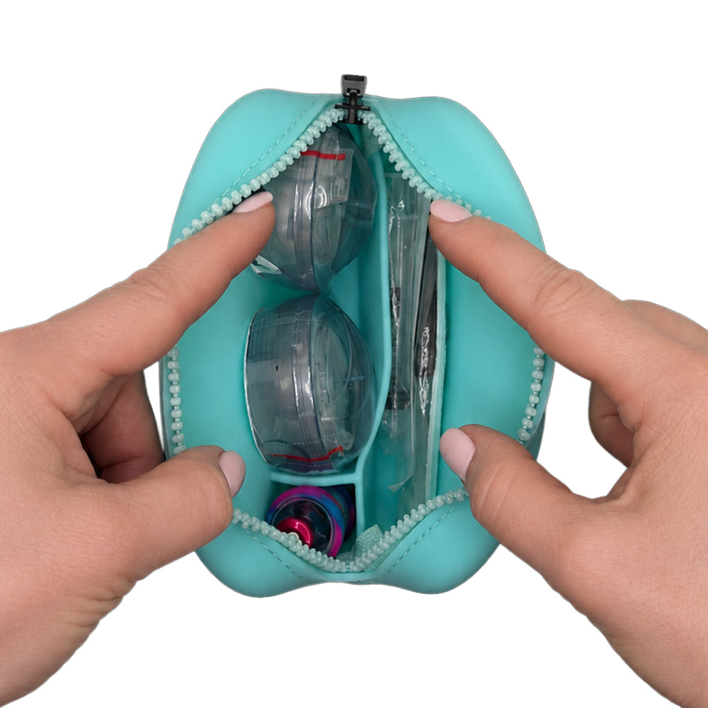 Aqua Tandem Protective Travel Case with Tandem supplies, held open by hands on a white background
