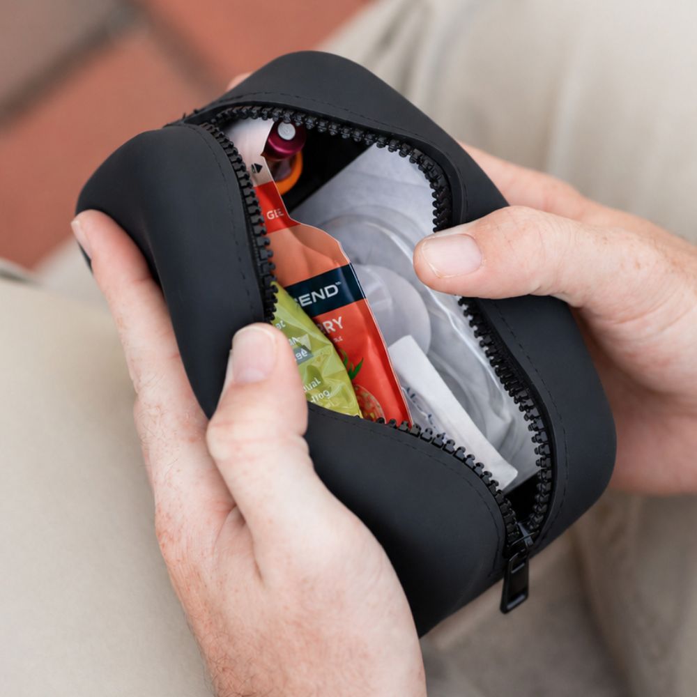 Black Tandem Travel Case with Tandem supplies and glucose in it. 