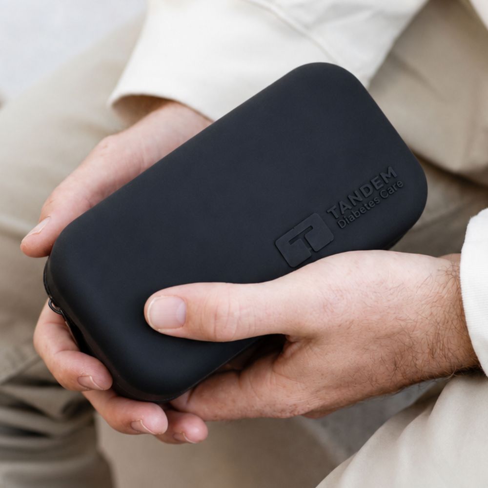 Black Tandem Travel Case held in hands. 