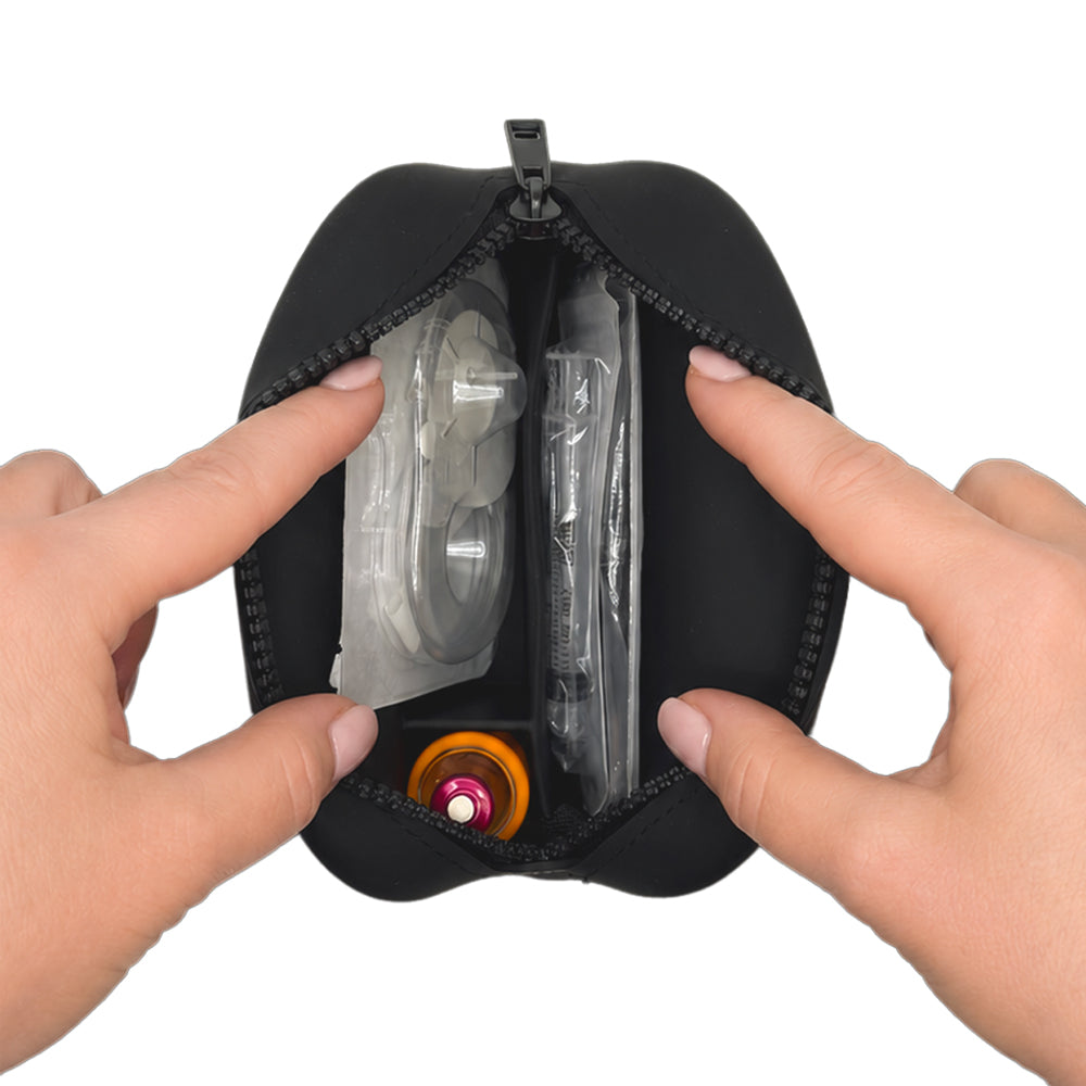 Black Tandem Protective Travel Case with Tandem supplies, held open by hands on a white background