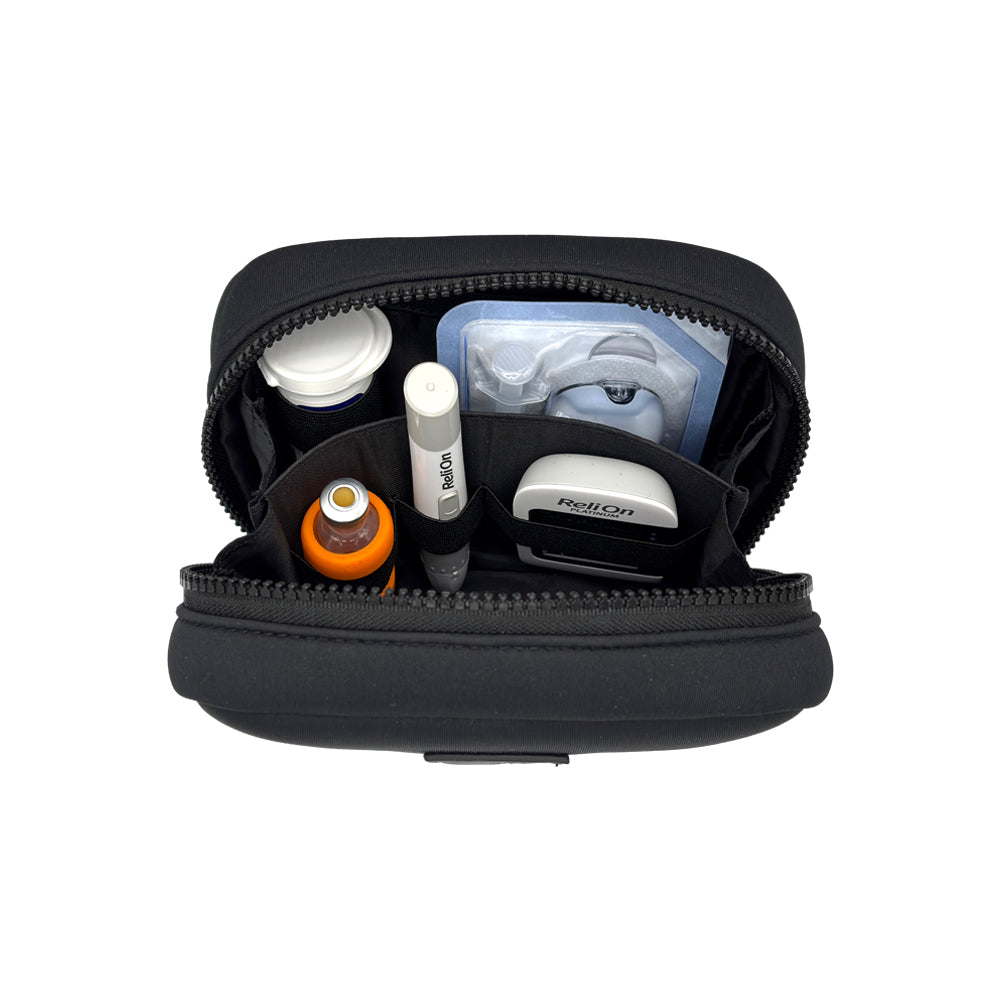 Open view of the Omnipod® Metro Supply Case in Black, displaying neatly organized pod and other diabetes supplies inside the case.