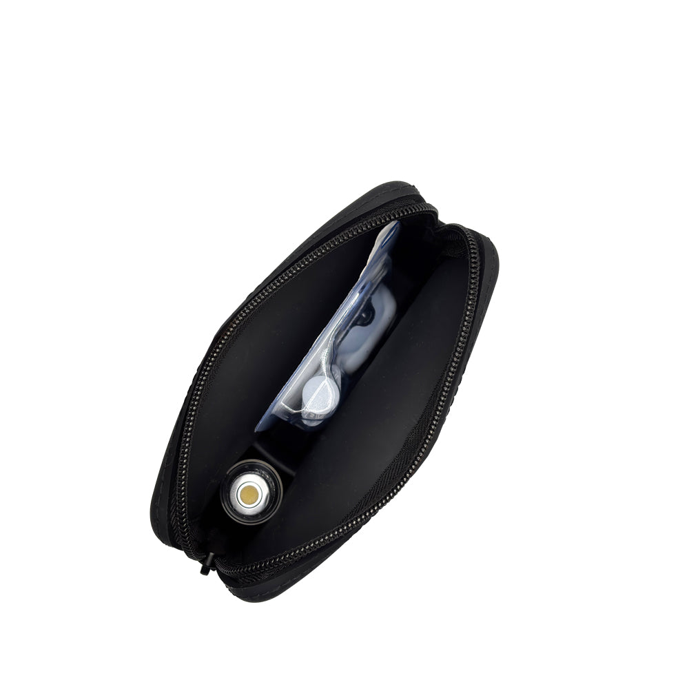 Top image showing inside of the case: A top-down view of the inside of the black Omnipod® protective travel case, showcasing the compartments and how items like an Omnipod® pod and insulin vial are stored in an organized manner.